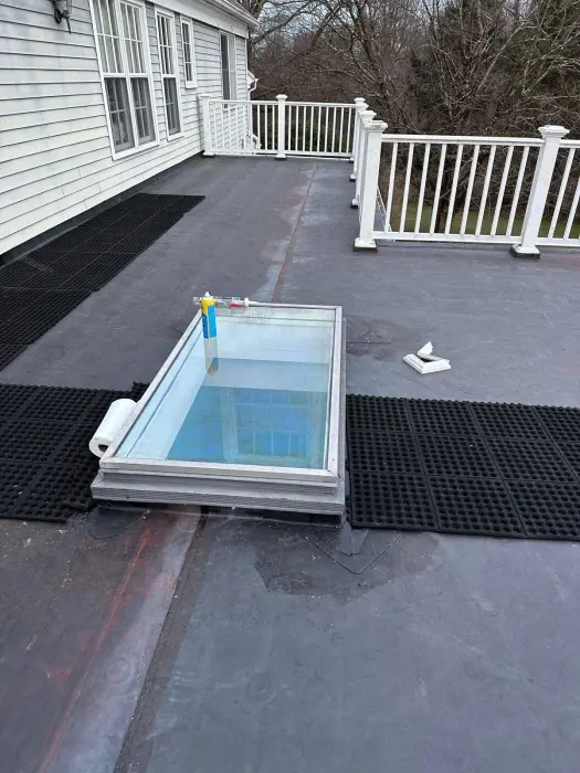 Small above-ground pool built into a backyard deck.